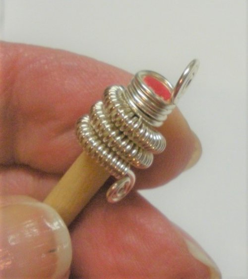 Judy Larson's Coiled Wire End Caps - , Findings & Components, Toggles & Clasps, Earwire & Headpin, Coiling, Coiling Wire, Wire Coiling, Push the end cap to the end of the mandrel.  